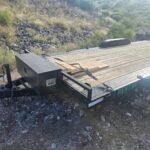 Monsoon Trailer Rental LLC flatbed trailer with "RENT ME" text